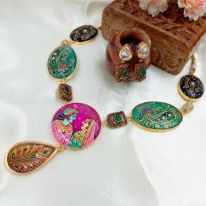 ARNAS HAND PAINTED SHREE RADHA KRISHNA TANJORE ART ON PURPLE STONE WITH TRADITIONAL DESIGN ON GREEN & BLACK STONE JEWELLERY NECKLACE SET