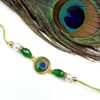 ARNAS 1 PC PEACOCK FEATHER MOTIF KUNDAN WITH LOOK ALIKE PEARL DESIGNER RAKHI