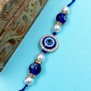 ARNAS 1 PC BLUE ROUND MOTIF EVIL EYE CHARMS DESIGNER RAKHI