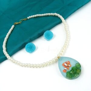 ARNAS COMBO SET OF SKY BLUE RESIN DROP MOTIF PENDANT WITH WHITE LOOK ALIKE PEARL & EARRINGS WITH AQUARIUM DESIGN