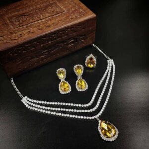 ARNAS SILVER TONED AMERICAN DIAMOND WITH GOLDEN YELLOW STONE DESIGNER EARRINGS NECKLACE SET