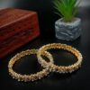 ARNAS 2 PAIR GOLDEN METAL 2X6 DESIGNER KUNDAN MOTIVE BANGLES